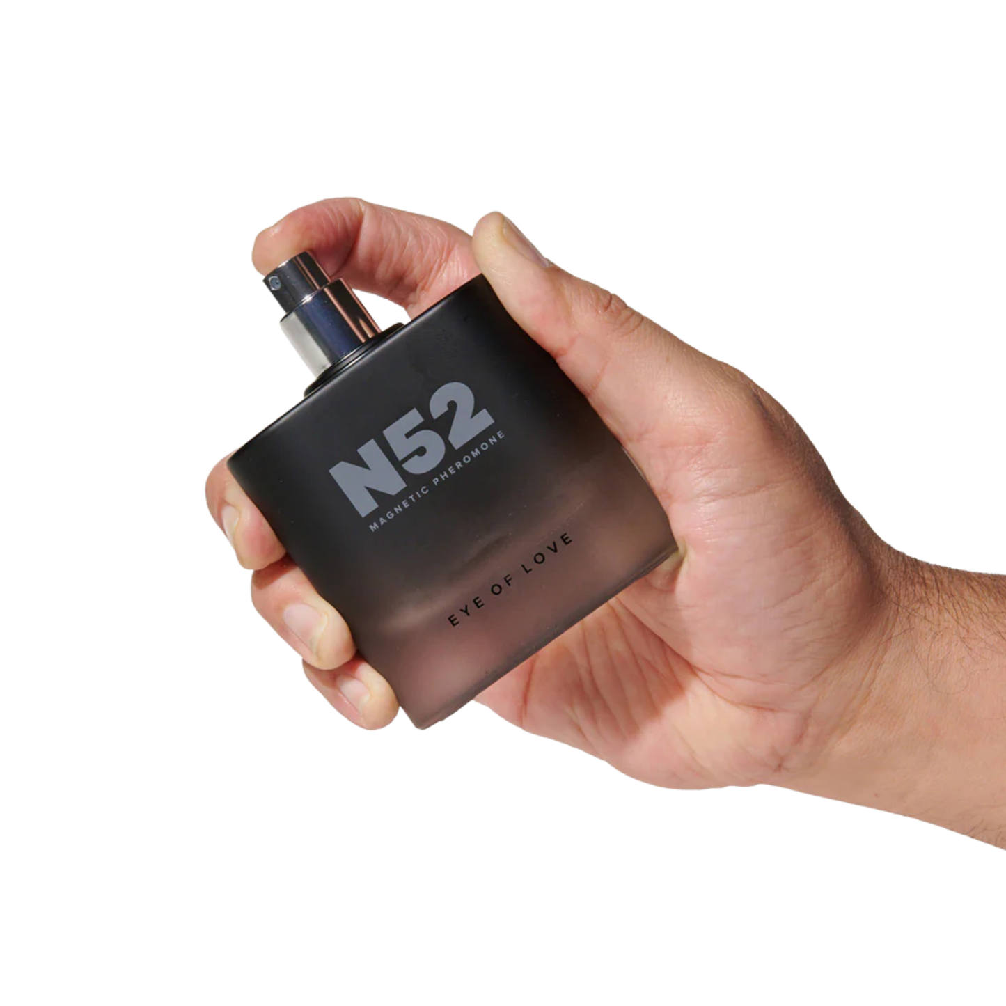 A hand holding a black bottle of N52 Magnetic Pheromone Cologne by Eye of Love.