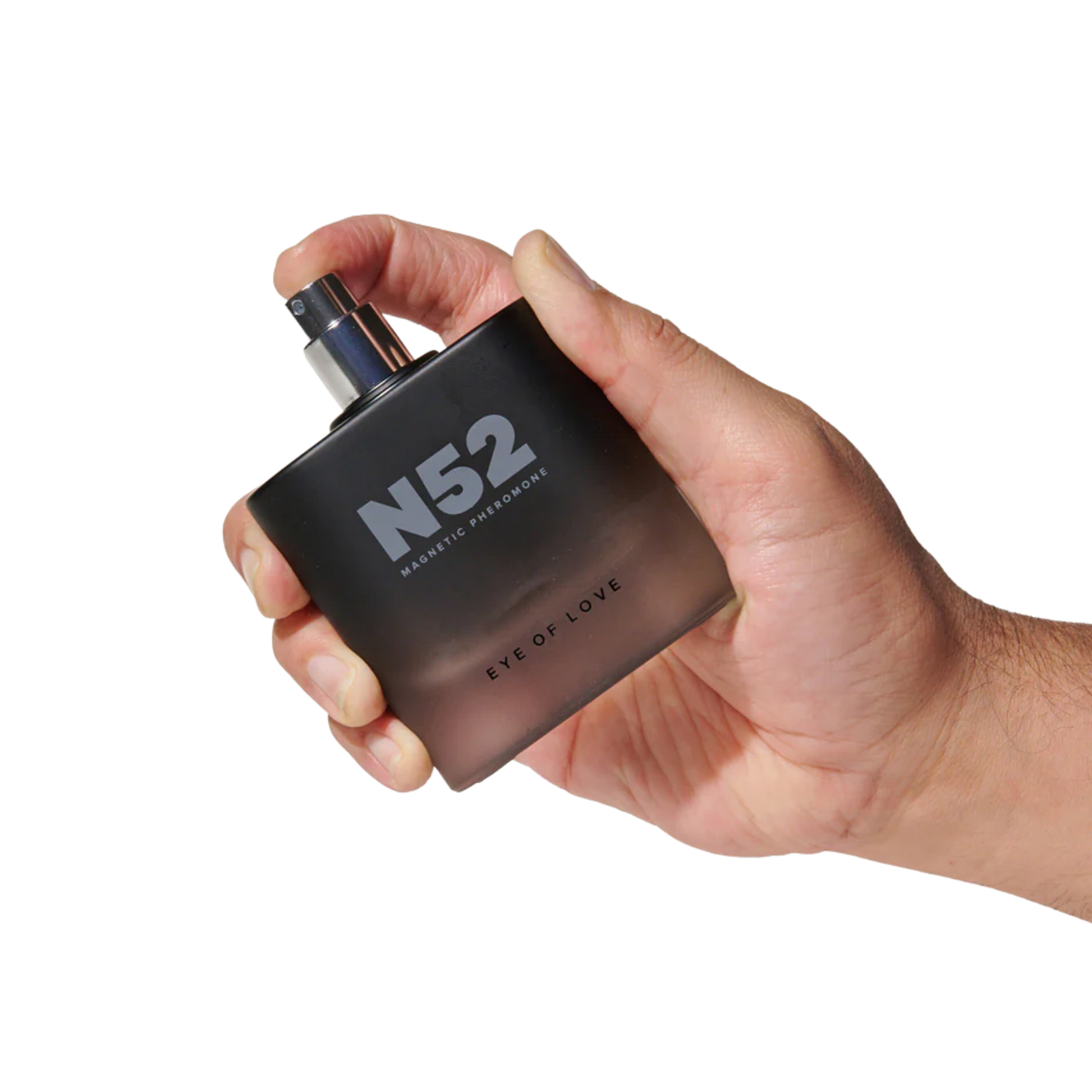 A hand holding a black bottle of N52 Magnetic Pheromone Cologne by Eye of Love.
