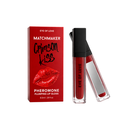 Two black and silver tube of pheromone plumping Crimson Kiss lip gloss by Eye of Love next to the box.
