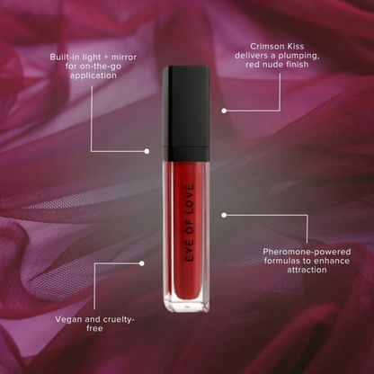 A red tube of plumping Crimson Kiss lip gloss by Eye of Love against a red background with lines pointing out details of the gloss.