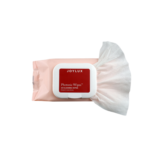 A light pink package of Photonic Wipes for devices by Joylux with one sticking out.