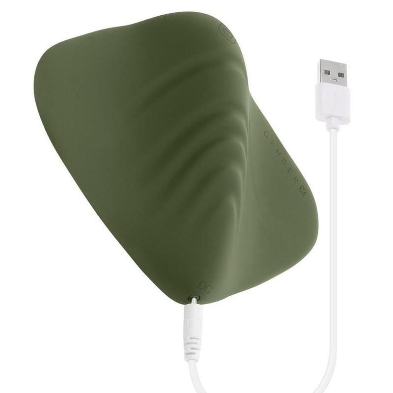 Green grinding pad with a white USB cable on a white background
