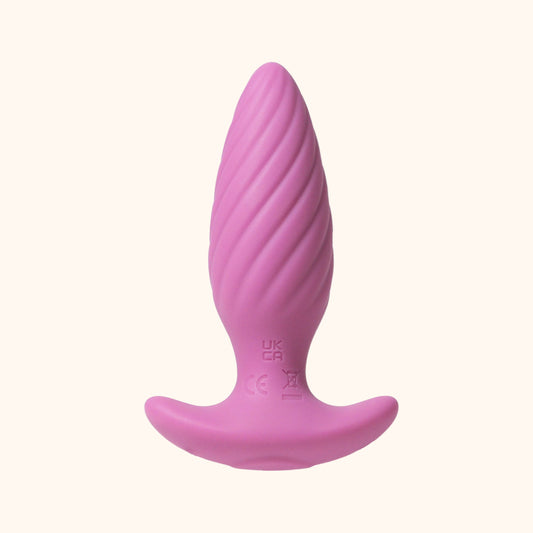 Pink Plot Twist silicone butt plug on a white background.