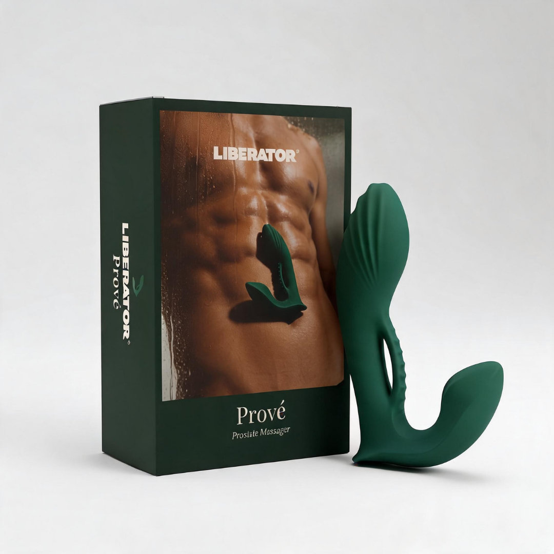 A green Prove Prostate Vibrator by Liberator sitting beside its box.