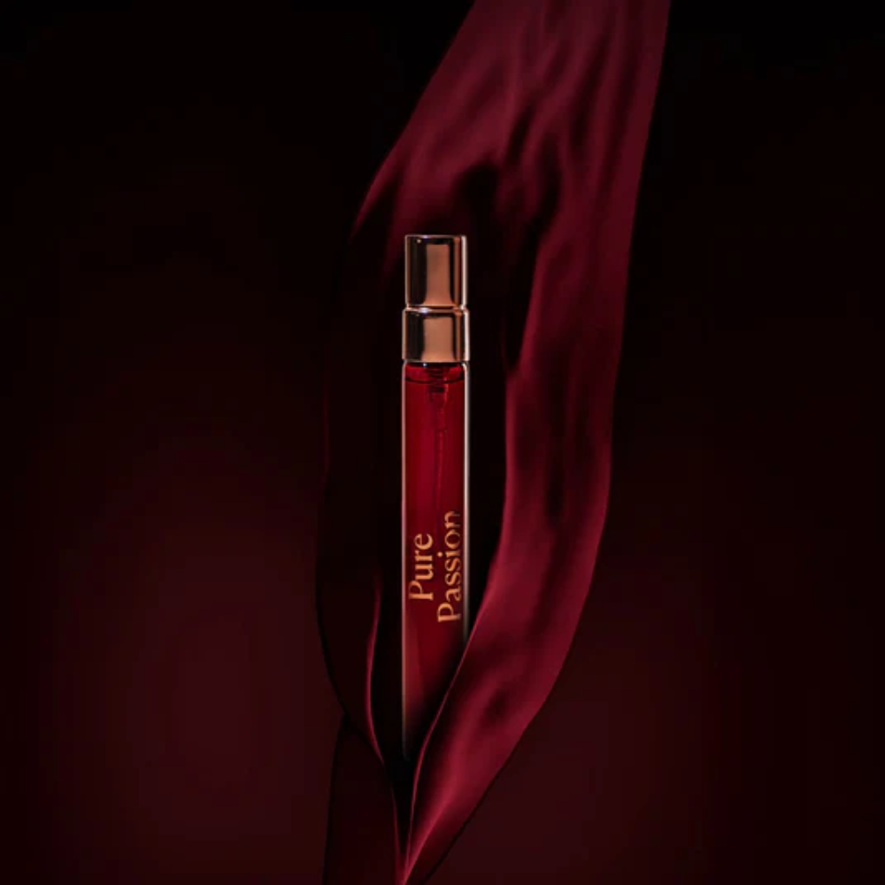Small travel sized bottle with 'Pure Passion' by High On Love text on a dark background