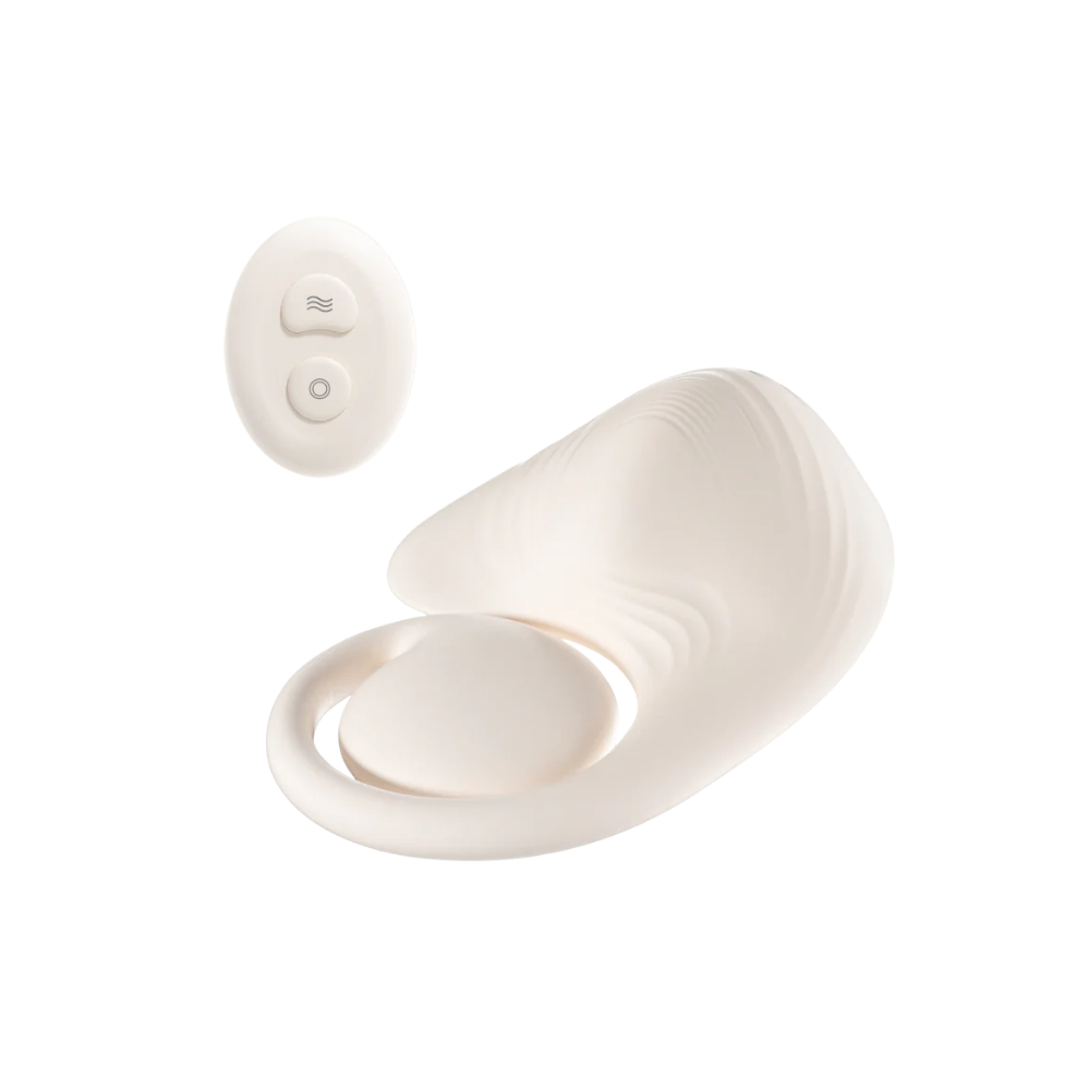 White Grider pad with remote next to it.