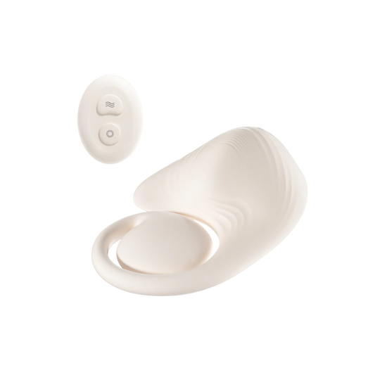 White Grider pad with remote next to it.