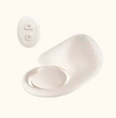 White grinder pad with a remote control on a white background