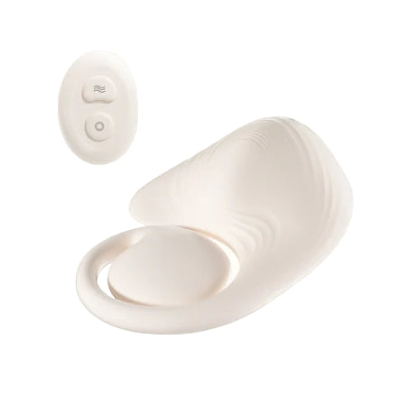 White grinder pad with a remote control on a white background
