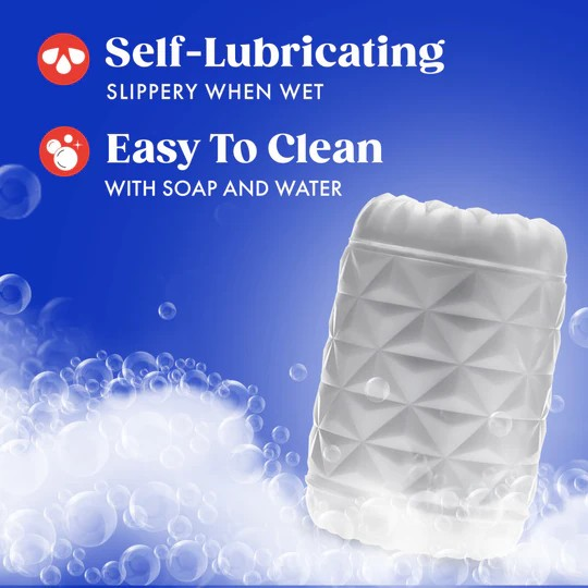 A Reakt white textured male sleeve on a blue background with a bubbles showing that it is easy to clean and self-lubricating.