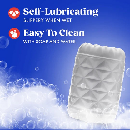 A Reakt white textured male sleeve on a blue background with a bubbles showing that it is easy to clean and self-lubricating.