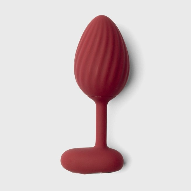 A single red Rouge backdoor plugs against a white background.