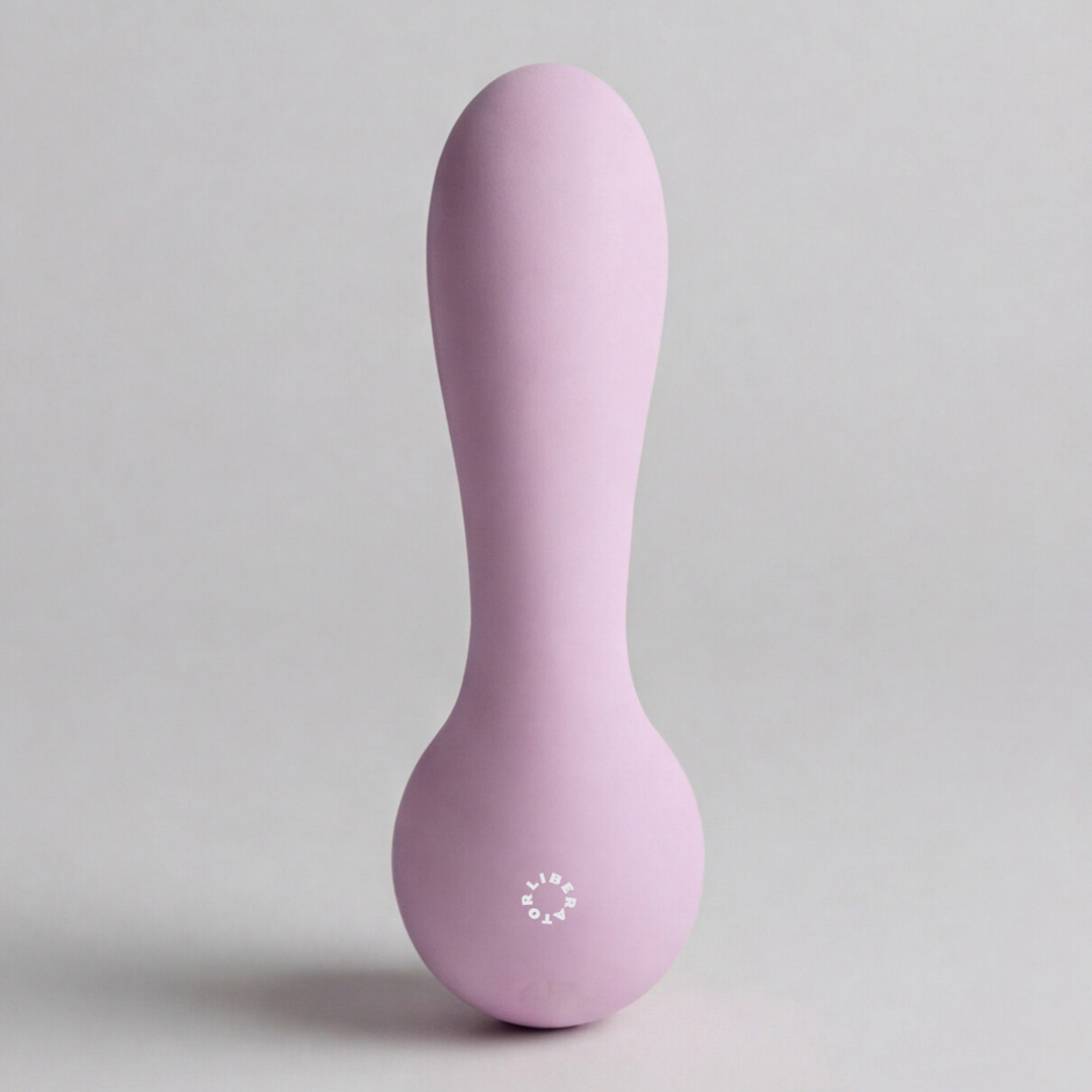 The back of a pink Rya rabbit massager vibrator against a white background.