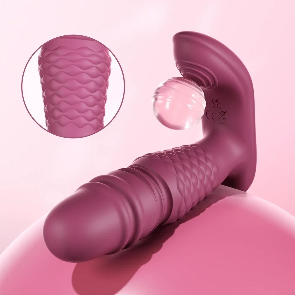 A purple Ryder Thrusting Vibrator against a white background with a close up of the ridges.