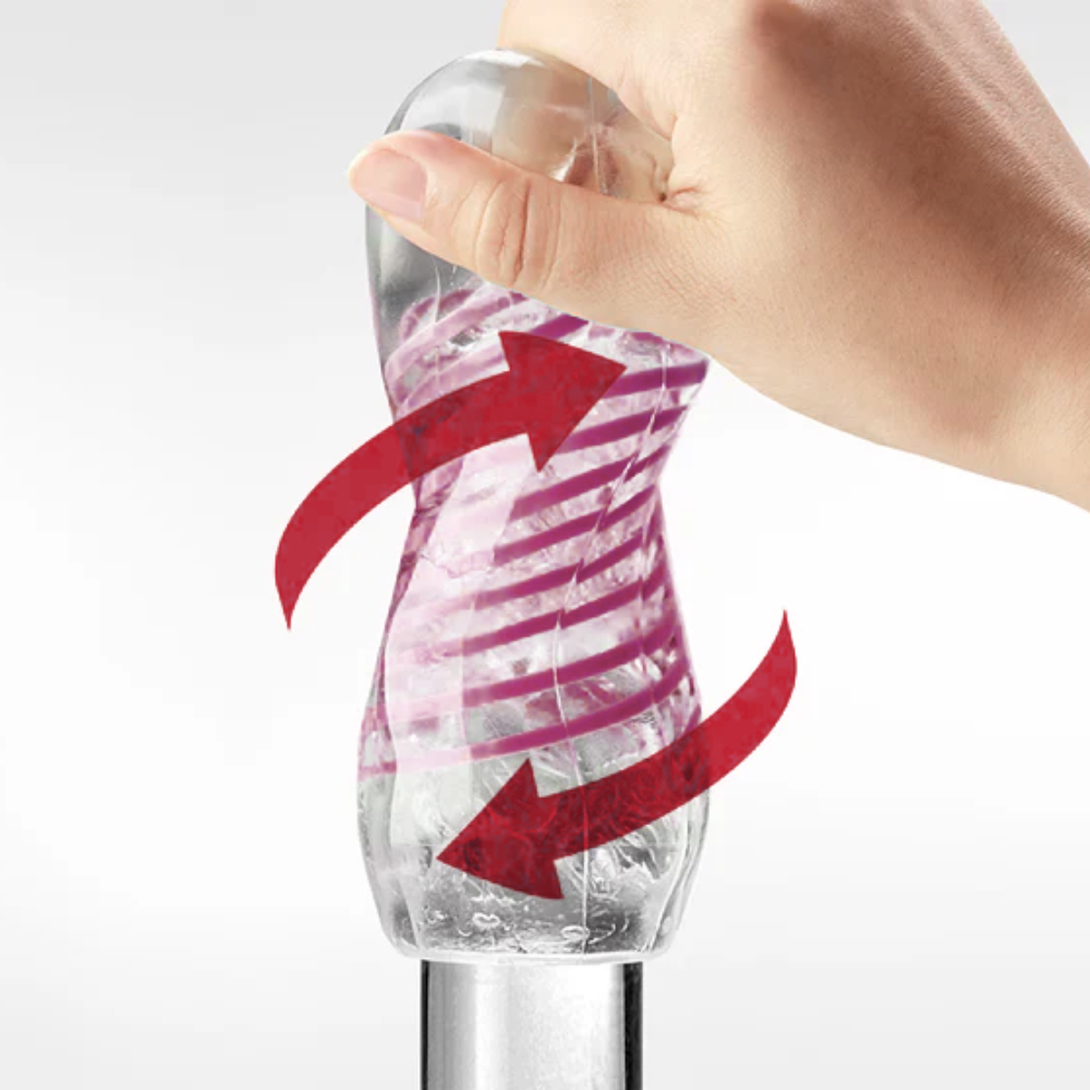 Hand holding a clear male sleeve with pink and red arrows showing movement on a white background