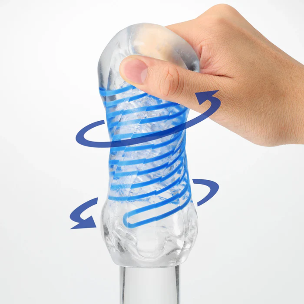 Clear silicone sleeve with blue spiral design being held by a hand on a white background
