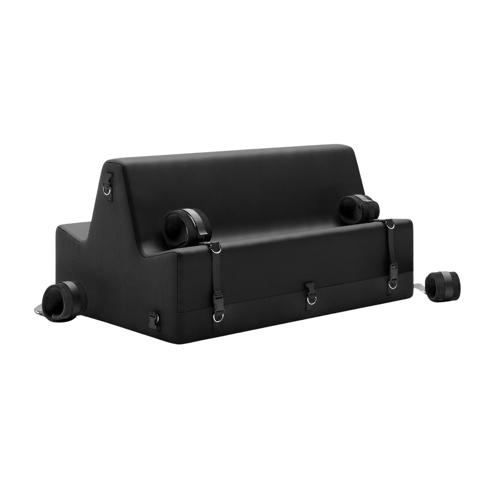 Black spanking bench with cuffs on a white background