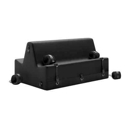 Black spanking bench with cuffs on a white background