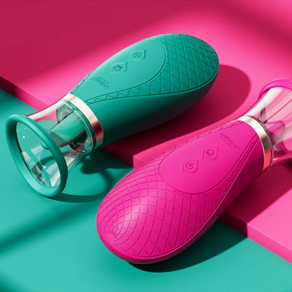 A pink and a green Sucking and Licking Scioness Clitoral Stimulator on a pink and green background.