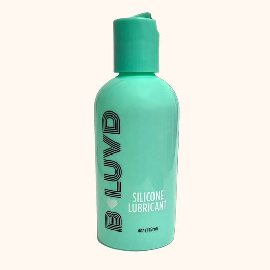 Turquoise bottle of BLUVD silicone lubricant on a white background