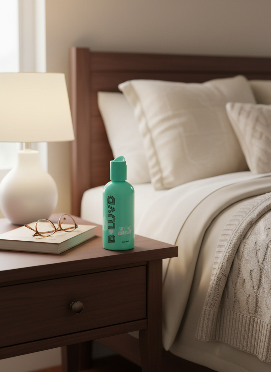 B-luvd silicone lubricant green bottle on bedside table 