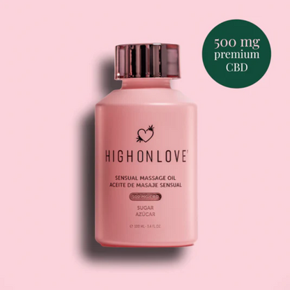 A pink bottle of Sugar High Massage Oil by High On Love against a pink background showing it contains 500 mg premium CBD.