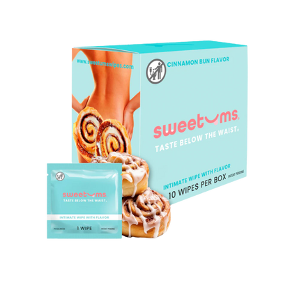 A box and individual package of cinnamon bun flavored intimate wipe for her by Sweet Ums.