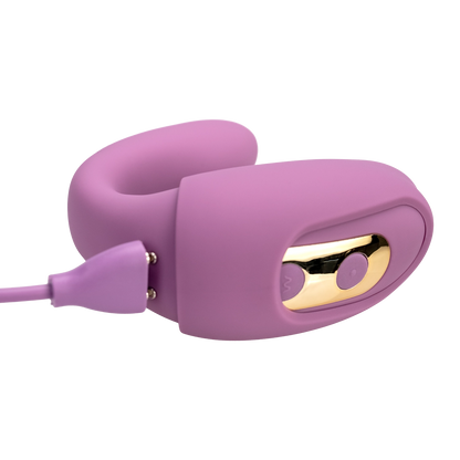 A purple The Adventurer Curve air pressure vibrator by Euforia charging.