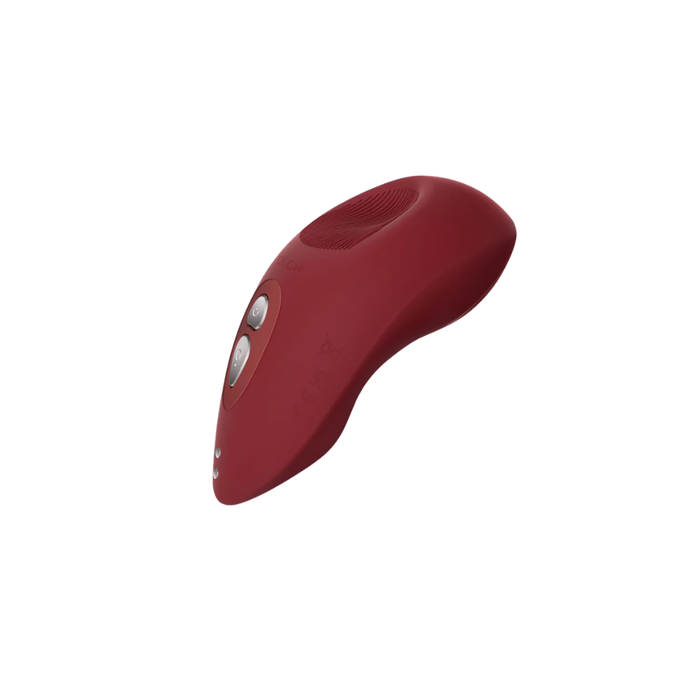 A red Tremble clitoral vibrator by Liberator.