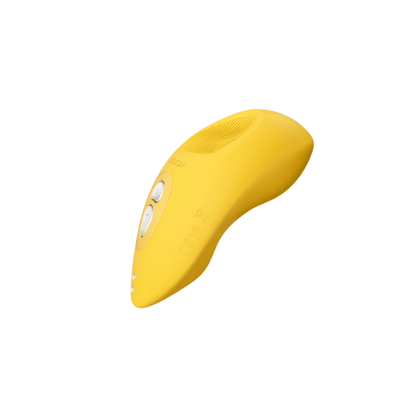 A yellow Tremble clitoral vibrator by Liberator.