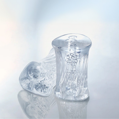 Two clear Cyclone Triple Chamber Strokers showing the side and top views of the chambers.