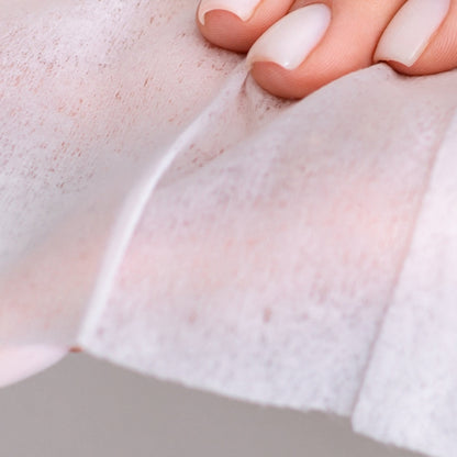 A hand holding a Beaver Butter Fresh Vaginal Wipe by ECN.