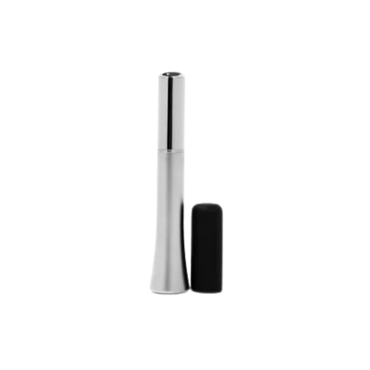A Wink discreet vibrator in silver next to the black silicone cap.