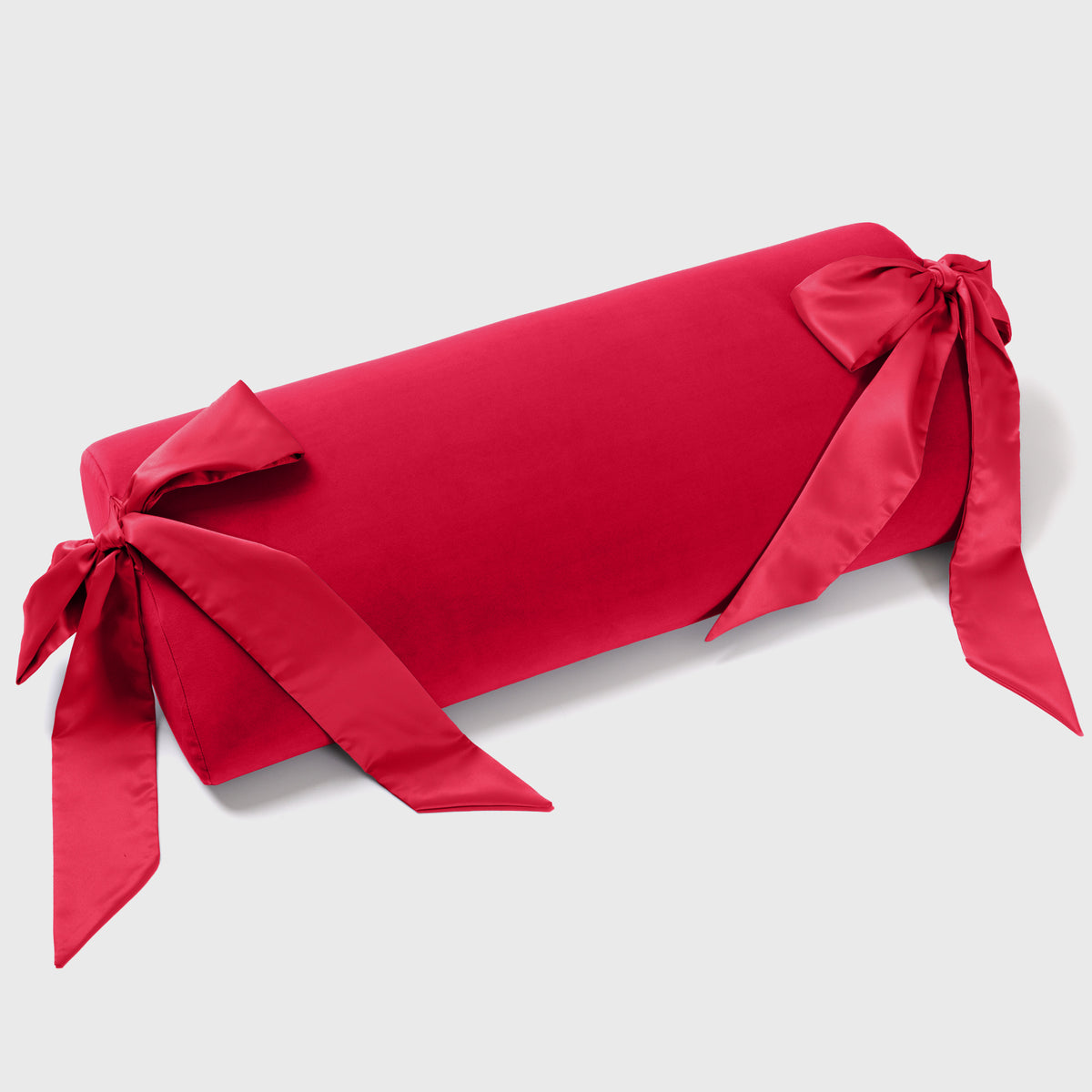 A red bondage pillow against a white background showing what comes in the Wrapped Up & Ravished Box.