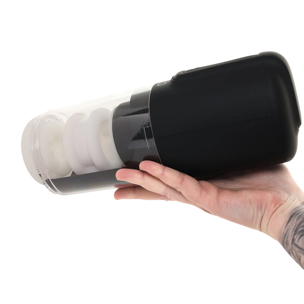 A hand holding a black Zolo Hawk Tuah Ultimate thrusting Masturbator.