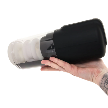 A hand holding a black Zolo Hawk Tuah Ultimate thrusting Masturbator.