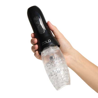 A hand holding a black Zolo Original Gwak Gwak Masturbator with a clear sleeve.