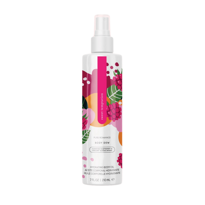 Lustra Hydrating Body Oil in Sweet Temptation by Pure Romance, featuring a colorful abstract label and spray nozzle, displayed on a glass shower shelf.