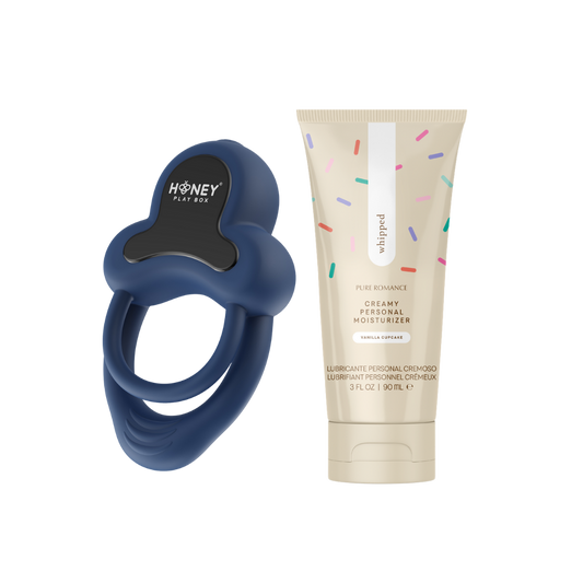 Blue anello c-ring and tube of whipped creamy lubricant on a white background