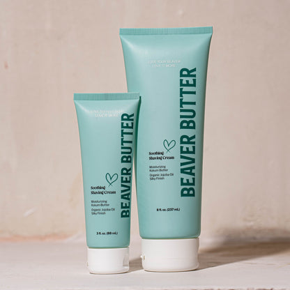 Two blue tubes of Beaver Butter soothing shaving cream on a white background showing a 3oz and 8oz.