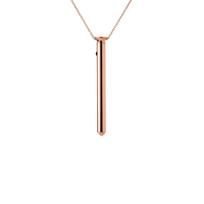 Rose gold necklace with a cylindrical pendant on a white background
